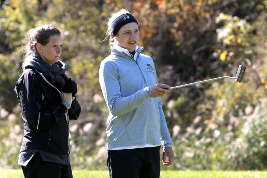 McKenna Montgomery (right) discusses her strategy with coach Abby Weber (left) in fall of 2019.