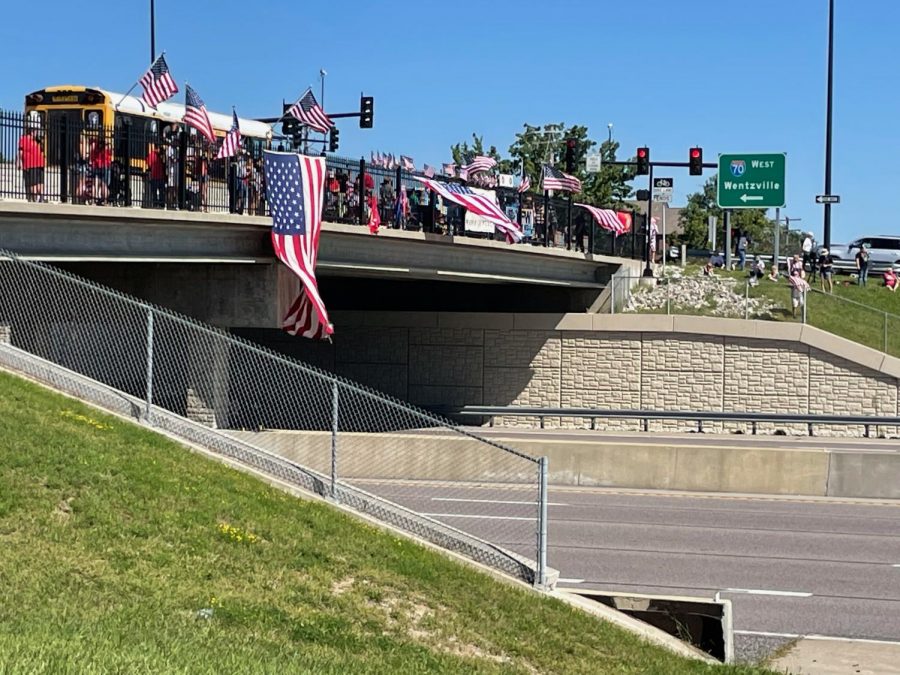 Saint Charles locals waiting for Schmitzs procession on the overpass near the Convention Center