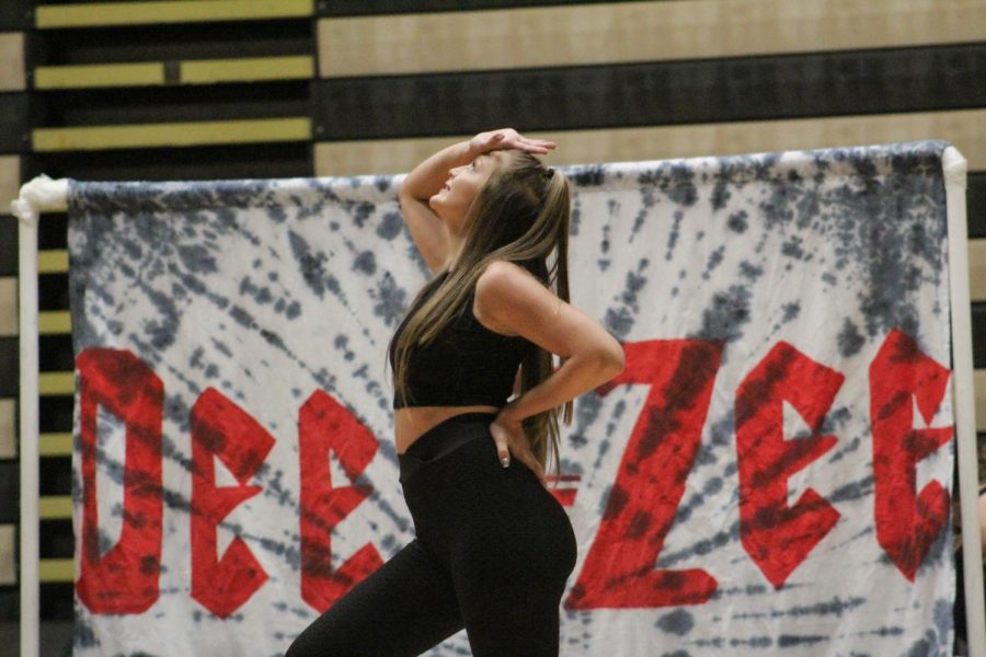 A+member+of+Delta+Zeta+dances+in+front+of+her+sororitys+banner.+Photo+by+Jessica+Spivey