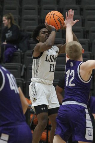 Junior guard Kevin Caldwell Jr.  jumps in an attempt to make a shot during the home game against Truman State University on Saturday, Jan. 22. Lindenwood won the game with a final score of 78-68.