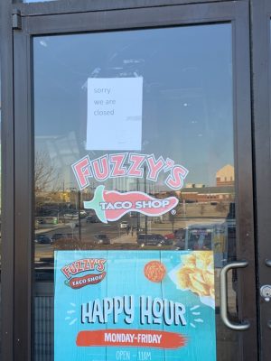 The entrance to the Fuzzys Taco Shop on West Clay Street in St. Charles. On the door, a sign is placed, informing potential customers of the stores temporary closure. 