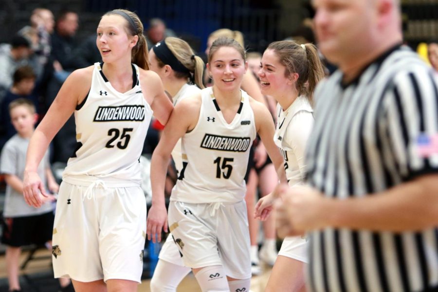 Forward Kallie Bildner (left) celebrates with guard Devin Fuhring (middle) during a home game against Missouri-St. Louis on Jan. 20, 2020. Fuhring hit a three pointer at the end of regulation to tie the game and send it to overtime. The Lions won 92-86. 