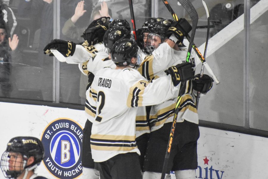 Senior+defenseman+Colton+Craigo+%28%232%29+joins+his+teammates+as+they+celebrate+after+a+goal+against+Central+Oklahoma+in+the+ACHA+National+Championship+Game+on+March+15+at+the+Centene+Community+Ice+Center.+The+Lions+won+the+game+8-3.+