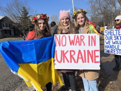Sophia Yereshchenko (left), Olesya Mukha (middle), and Olesya Chernenko (right) during a rally in support of Ukraine in St. Louis, on Feb. 26, 2022. 