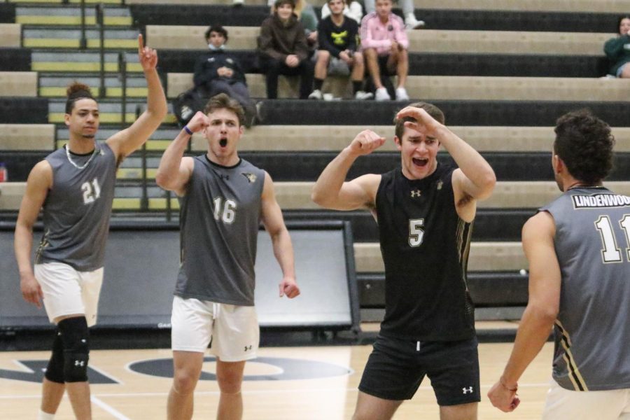 Junior+outside+hitter+A.J.+Lewis+%28left%29%2C+sophomore+setter+Connor+Sheehan%2C+and+junior+libero+Kyle+Deutschmann+%28right%29+cheer+with+their+teammates+after+winning+a+rally.