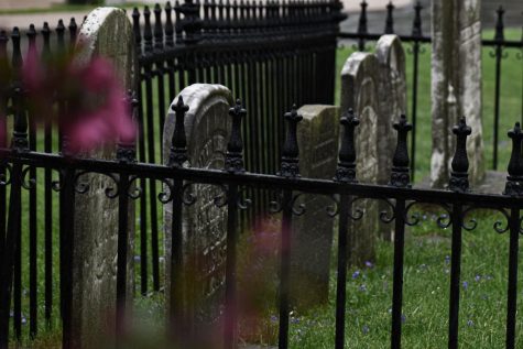 The graves residing within a fence inside the Sibley Cemetery. The graves date back to the early 19th century.