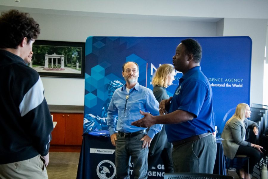 Donta Fairey (left) and Mark Gibson educate students on career opportunities with the National Geospatial Intelligence Agency.