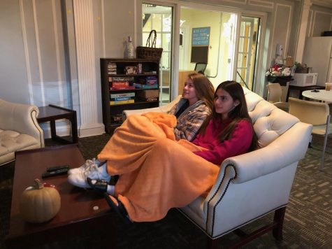 Junior Alicia Macias and Sophomore Brooke Gawlik watching Netflix on the TV in the Lounge in Irwin Hall.
