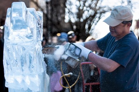 Art Phetsadasack carving “Call of the Wild” as a part of the five-block portion of the competition at the annual Fete De Glace ice carving festival.