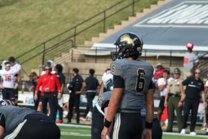 Lions' Quarterback Carter Davis prepares to take a snap against Austin Peay State University.