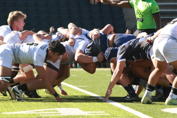 The Lindenwood Lions and BYU Cougars scrum at the 40 yard line