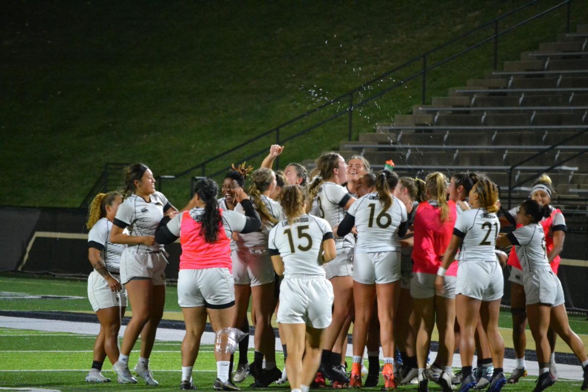 Womens Rugby team celebrating 27-0 victory against Life University