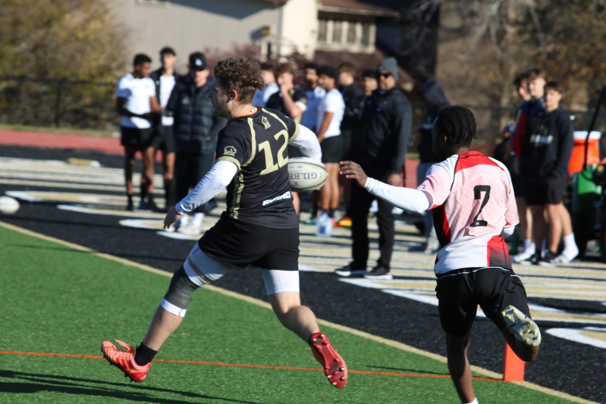 A Lindenwood player evades a Maryville player in a rugby match between the two teams. 