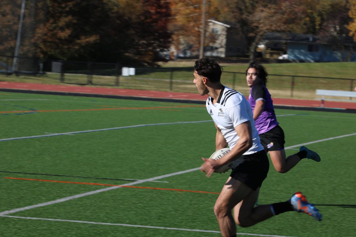 A Lindenwood player evades a defender from the University of Health Sciences and Pharmacy in St. Louis.