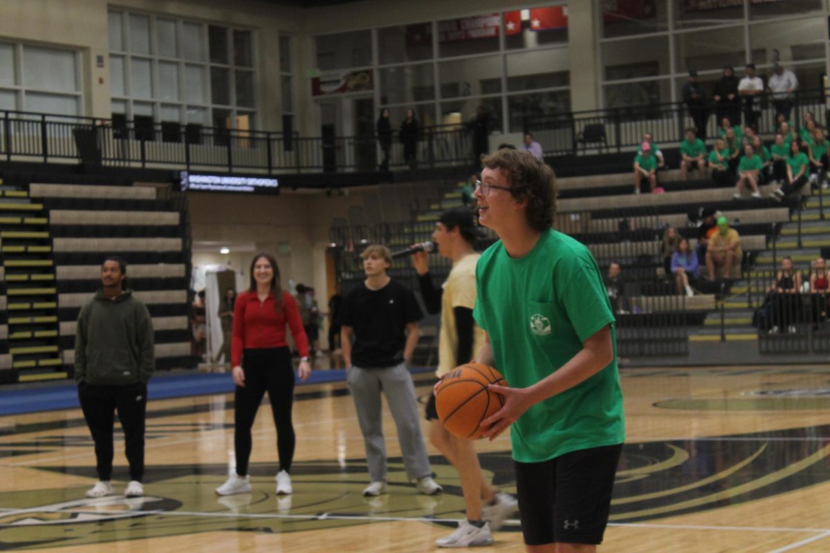 Andrew Conley competes in a free throw contest during Lip Sync. 