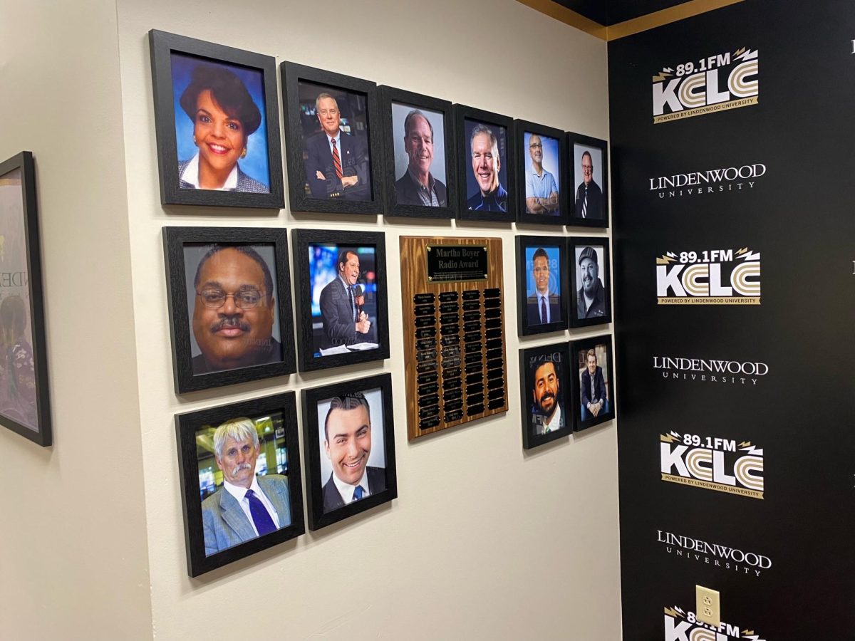 A display of KCLCs most famous alumni hung up in the stations studio. Amongst the pictures are David Amelotti, Greg Amsinger, and Scott Warman. 
