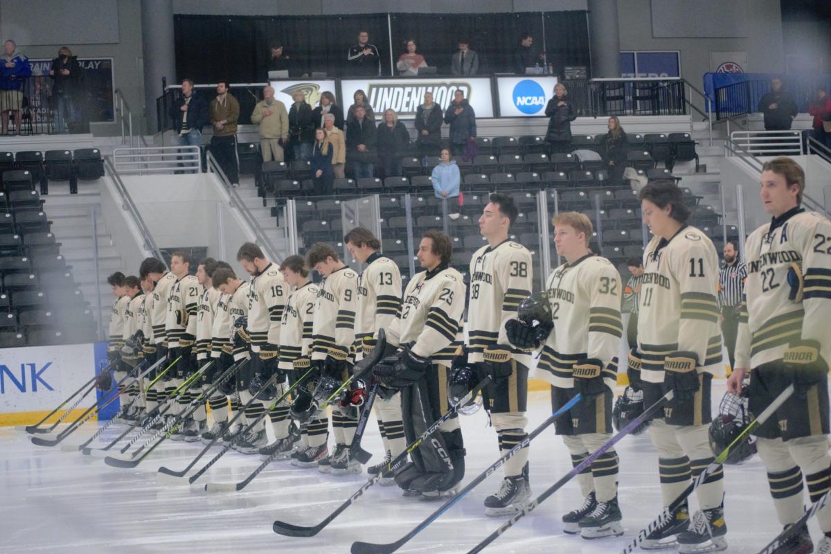 The Lindenwood Lions Division II Mens Hockey team stands for the national anthem prior to a game against Drury University.