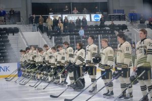 The Lindenwood Lions Division II Men's Hockey team stands for the national anthem prior to a game against Drury University.