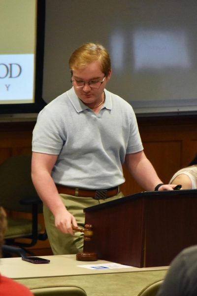 Lindenwood Student Body President Clayton Herbst adjourning the meeting in Dunseth Auditorium.
