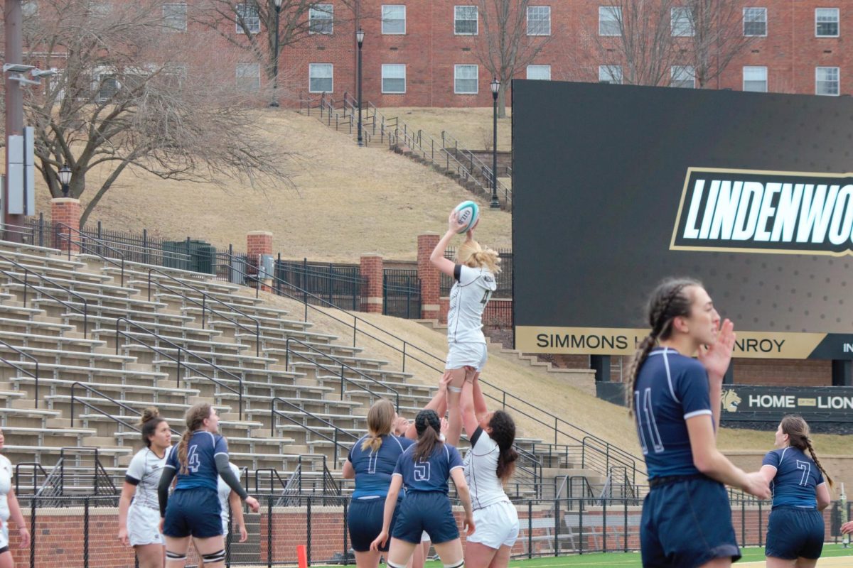 The Lions participate in a lineout lift during a game against Brigham Young University. 