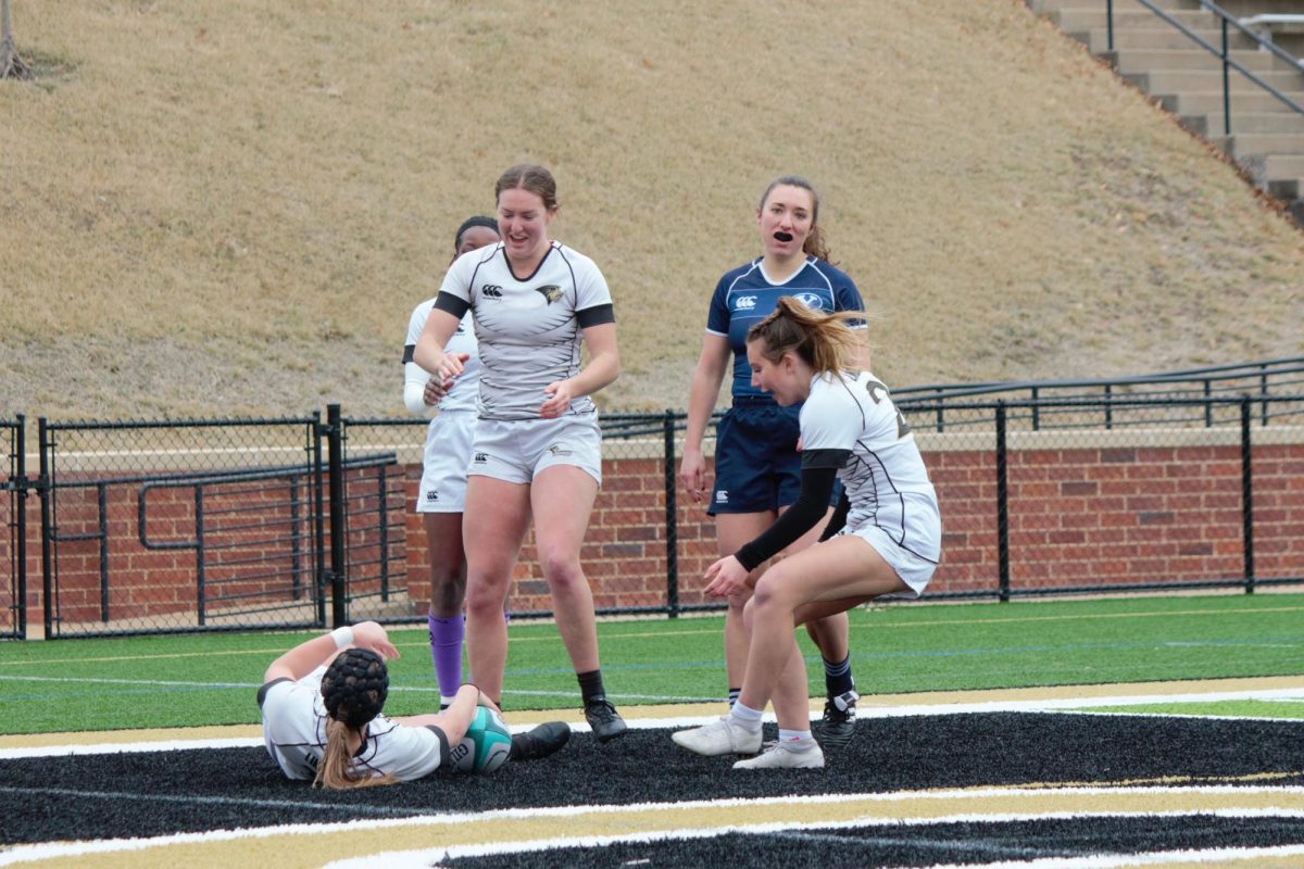 The Lindenwood Lions celebrate in the try zone after a score against Brigham Young University. 
