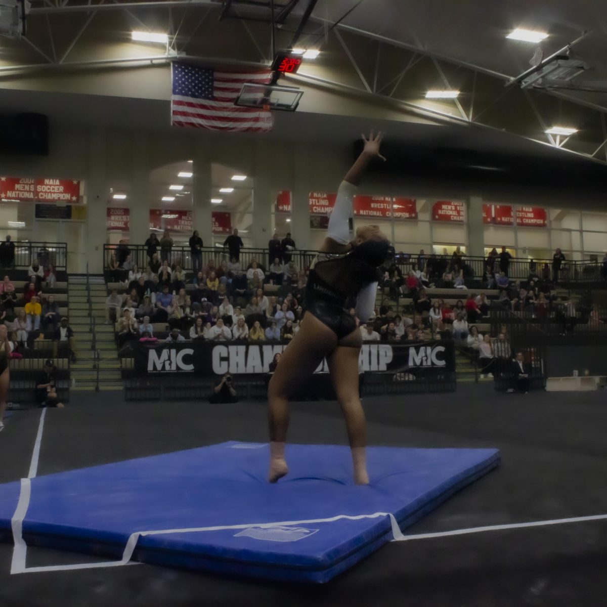 A Lindenwood Lion competes in her floor routine in the Midwest Independent Conference championship.