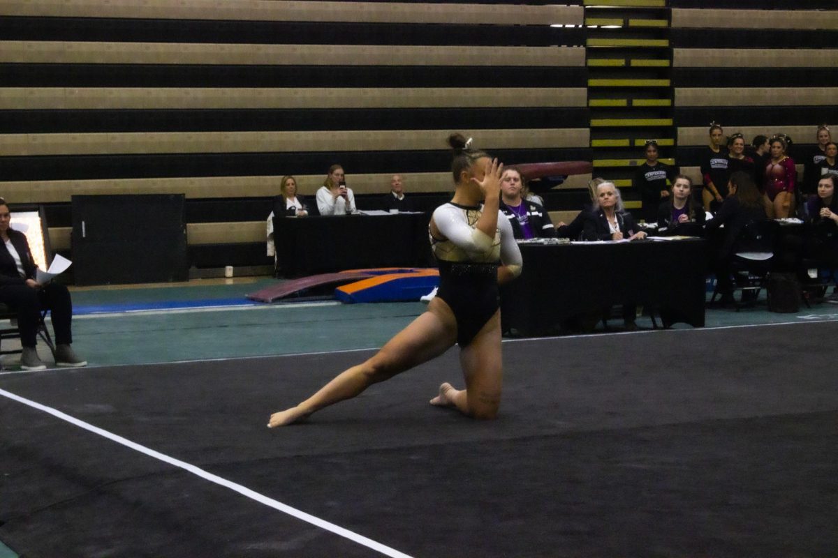 Jaly Jones competes on the floor routine during the Midwest Independent Conference championships. 