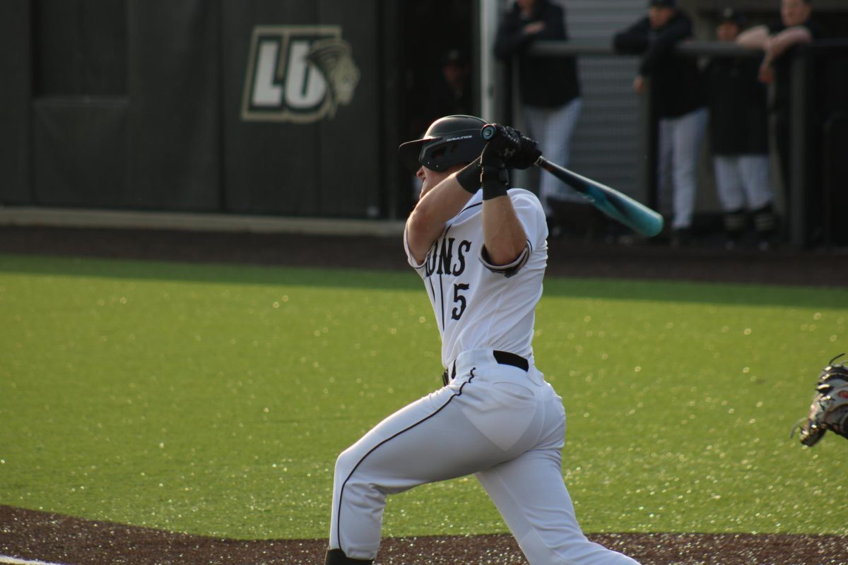 Evan Funkhouser swings at a pitch in a game against Omaha. 