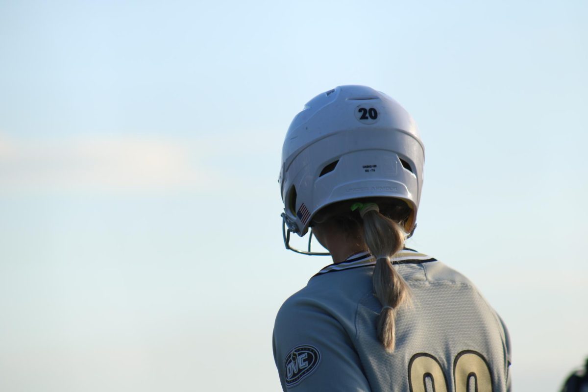 Irelynn West looks on as she waits on deck for an at bat against Bellarmine. 