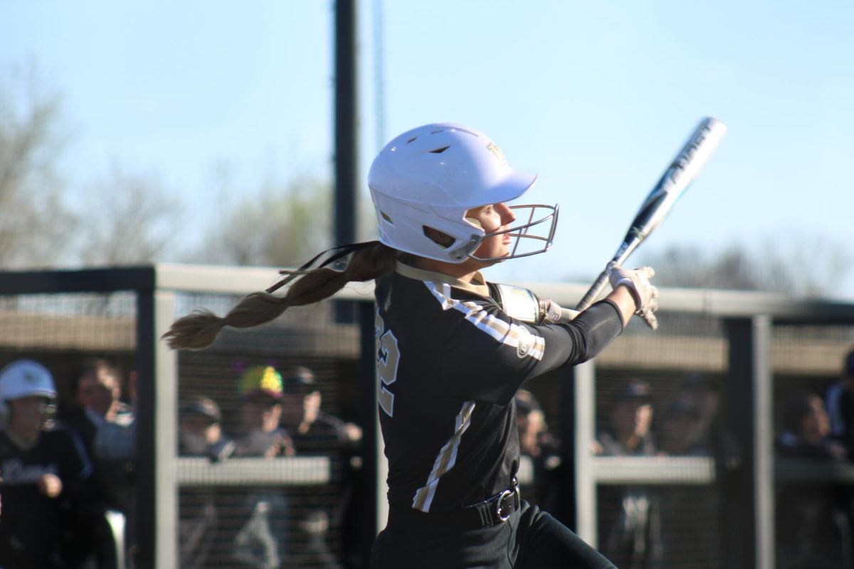 Madisen Noll swings at a pitch in a game against St. Louis University. 