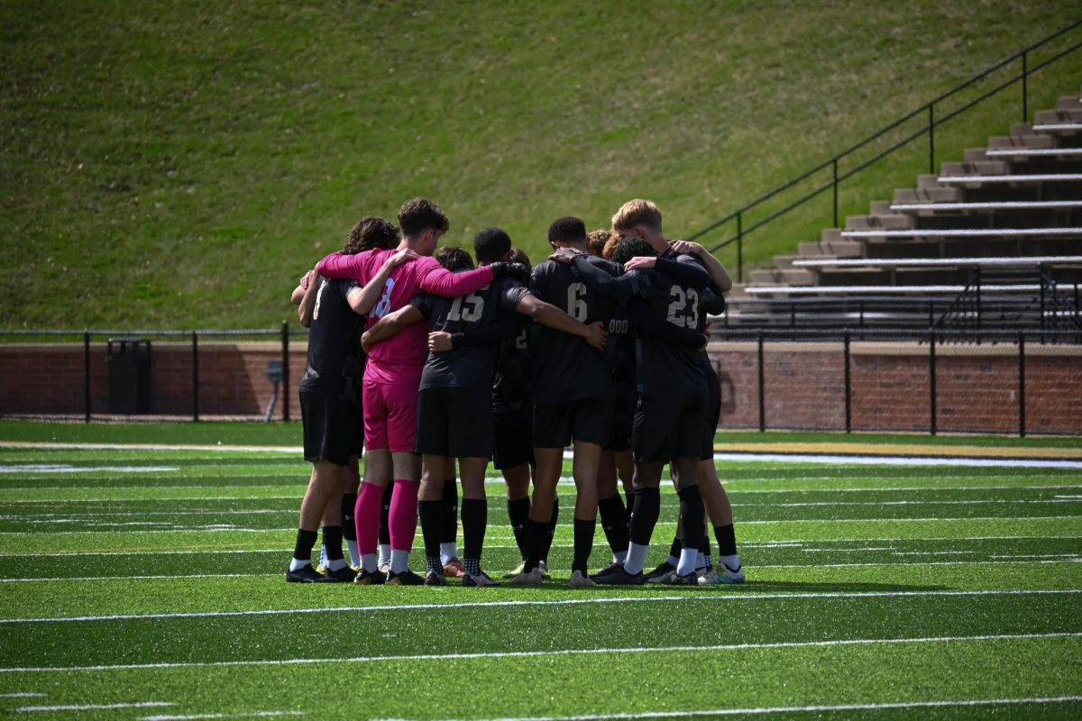 The Lindenwood Soccer team huddles before their game. 