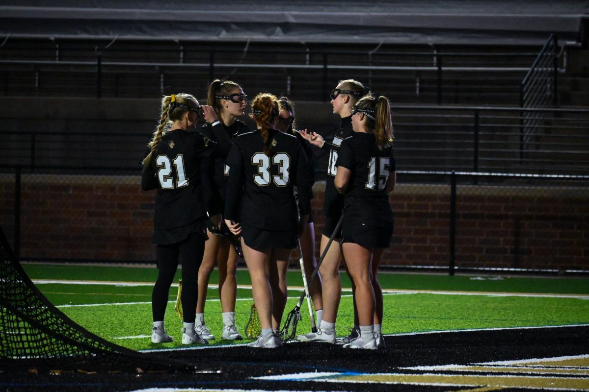 Lindenwoods womens lacrosse team huddle during a game against Kent State.
