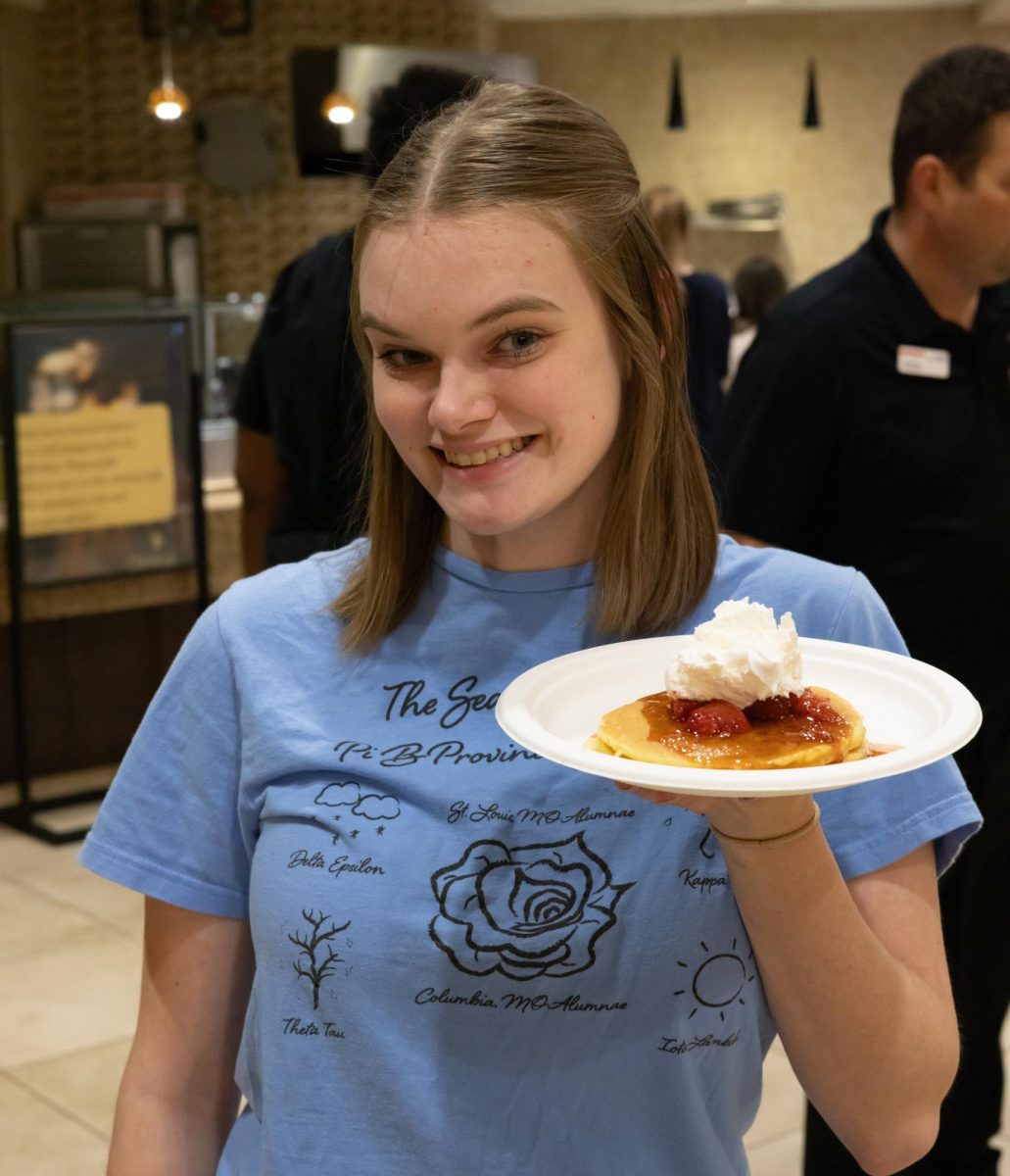 Maggie Dultz with food provided at Late Night Breakfast. The event offered free breakfast food to students.