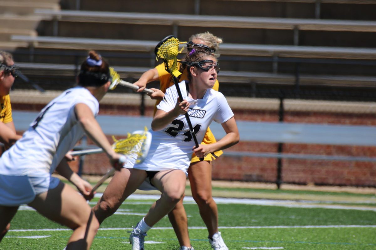 Alissa Digiacinto drives past Kennesaw State University defenders.
