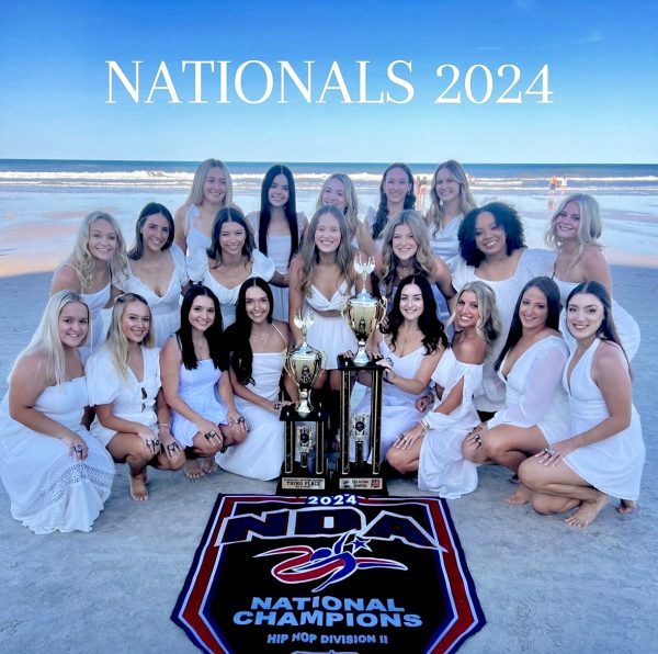 The Lionettes Dance team poses with their HipHop National Champions trophy.