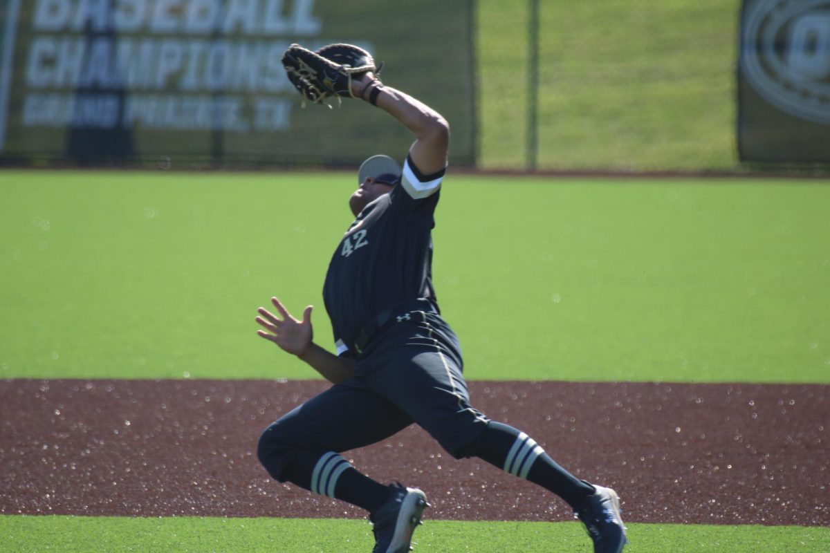 Bryson Arnette falls to the ground while fielding a ball against Little Rock.