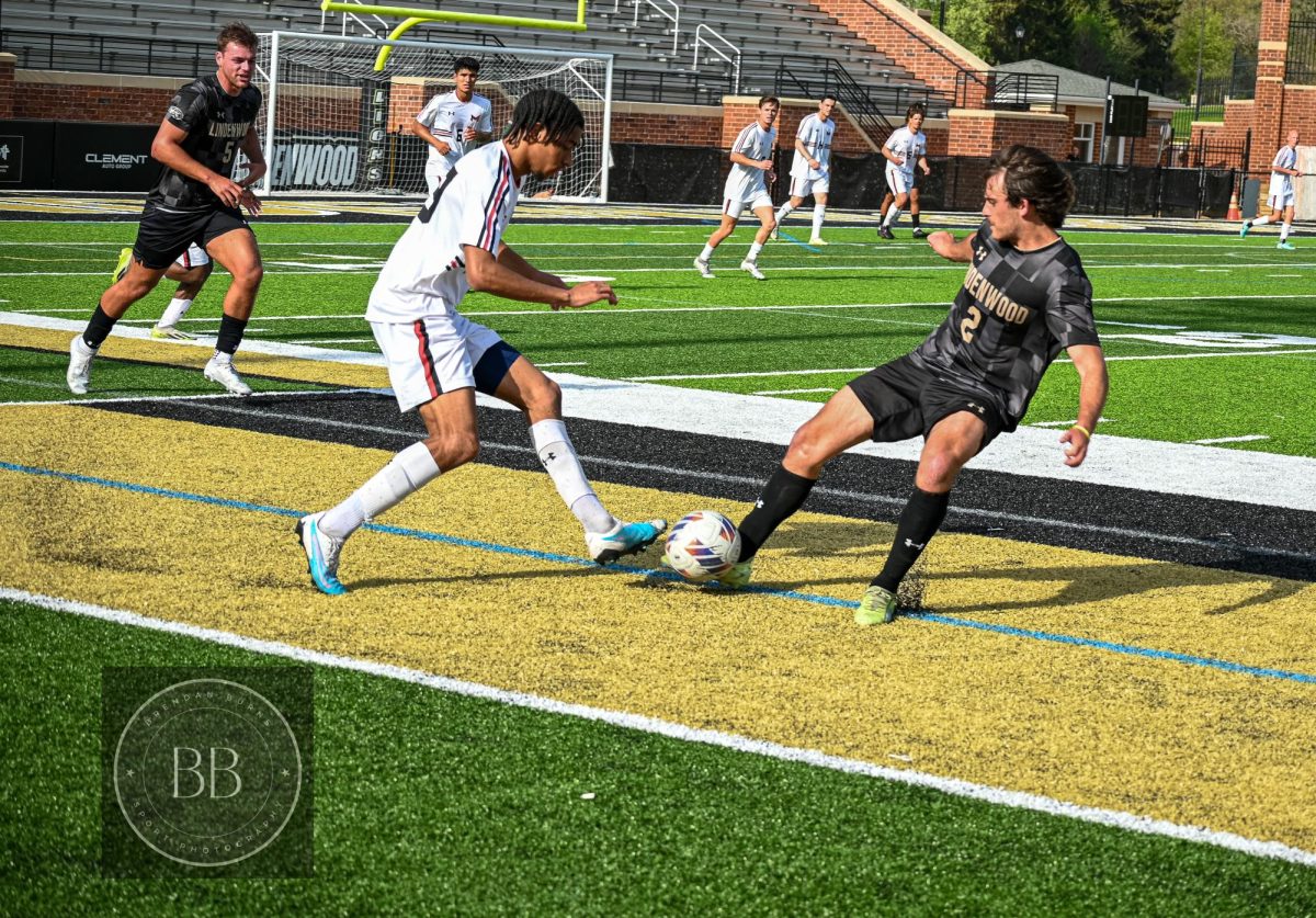 Josh Francombe moves the ball past a Maryville defender. 