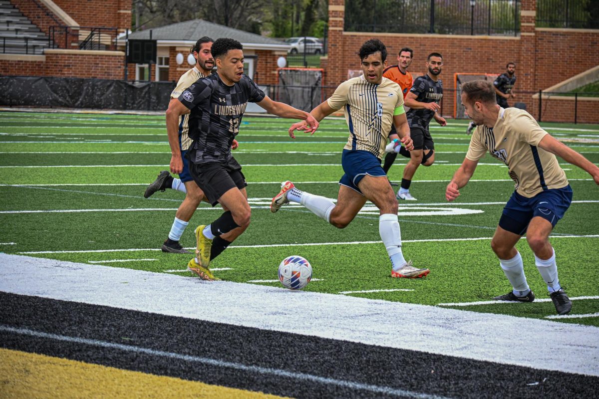 John Gates moves the ball down the pitch in a game against UIS.
