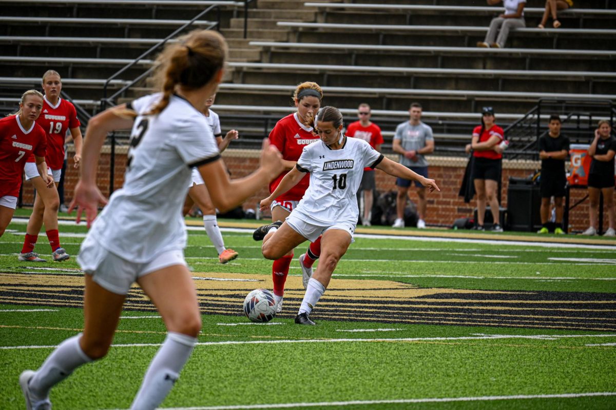 Rachel Jackson prepares to pass the ball toward teammate Lily Sutter in a game against SIUE. 