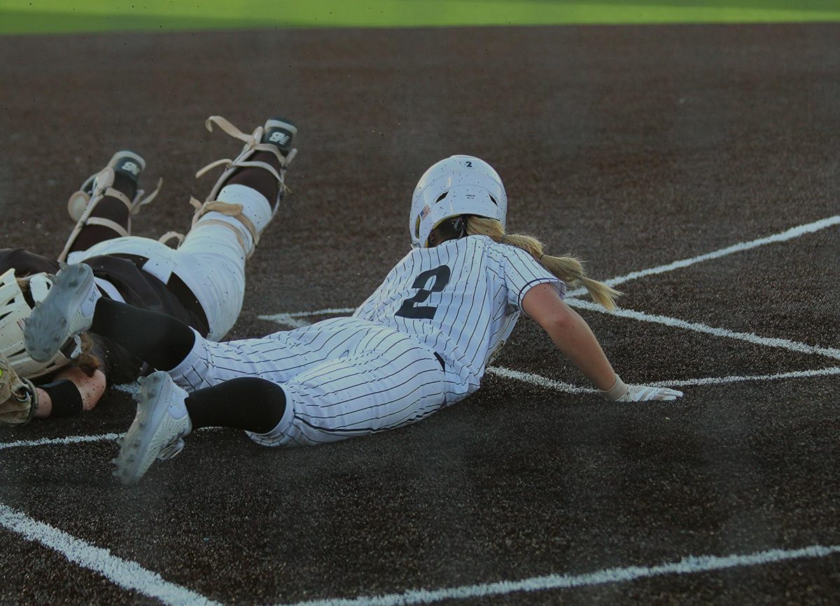 Lindenwood softball player Dallas Darnell slides into home. 