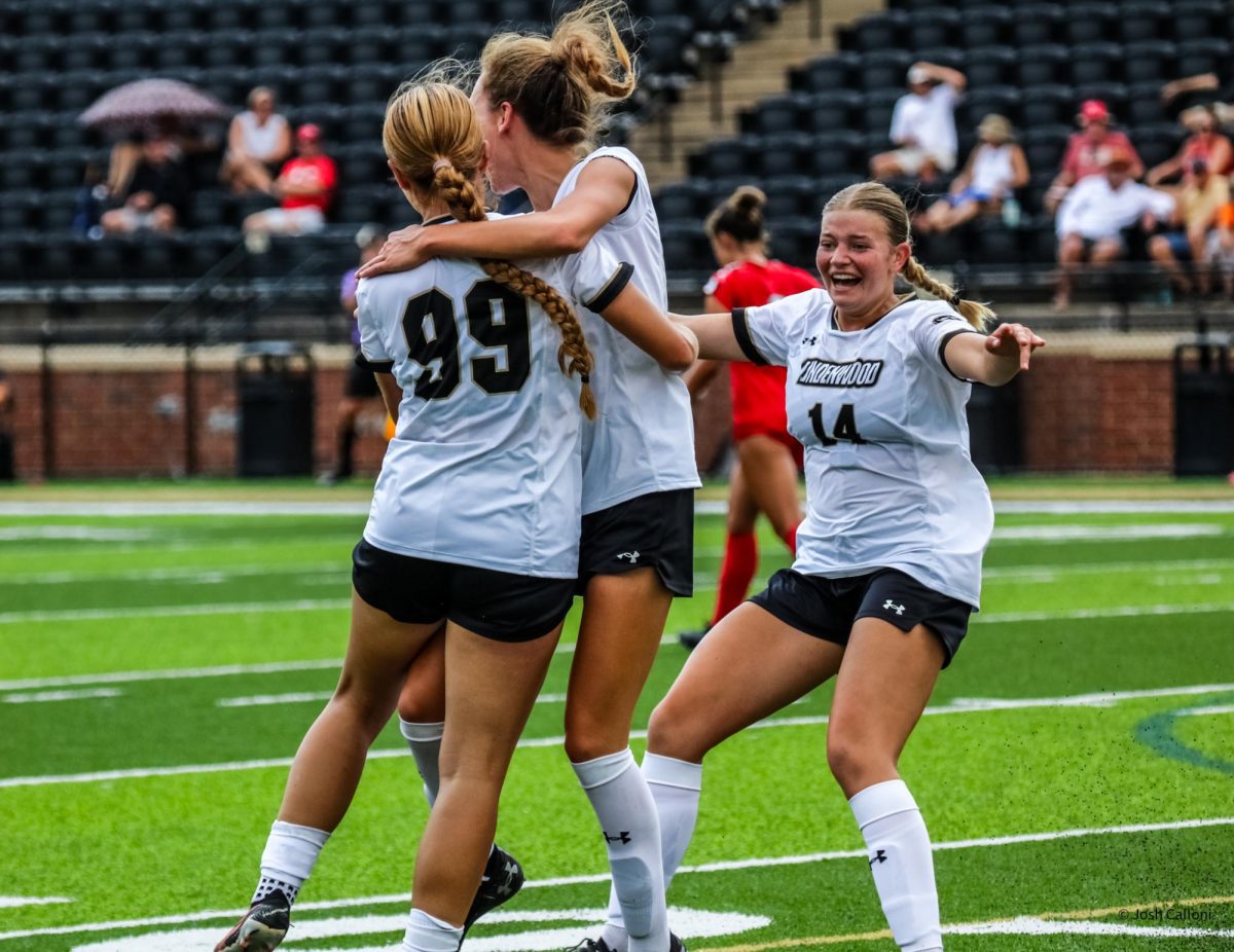 Tasneem Dizdarevic, Allisin Schrumpf, and Lily Sutter celebrate a goal scored by Dizdarevic. The goal would decide the game for Lindenwood. 