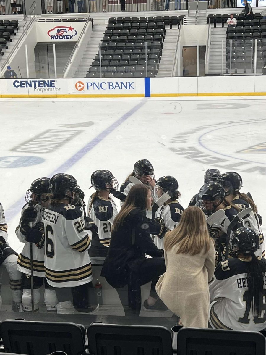 Head coach Taylor Wasylk coaching the women's ice hockey team against the St. Cloud State Huskies on Sept. 22 at the Centene Community Ice Center.