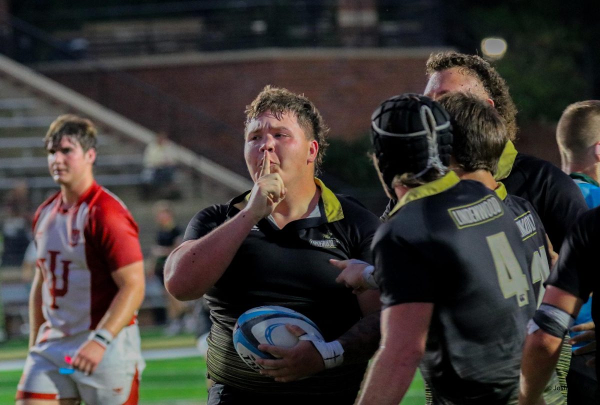 Luke Schaefer shushes the crowd after scoring a try against the Indiana University. 