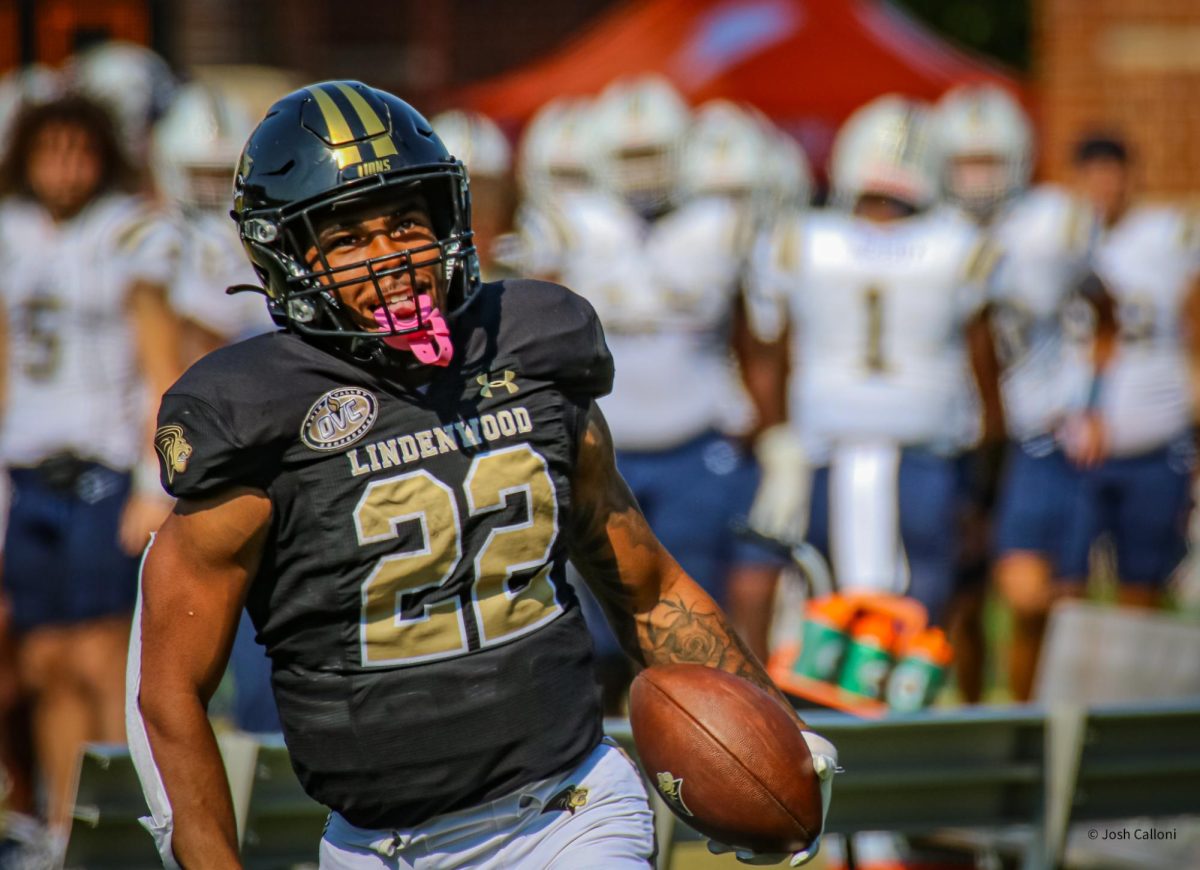 Steve Hall runs out of bounds after a large gain resulting in a first down in a game against Charleston Southern.