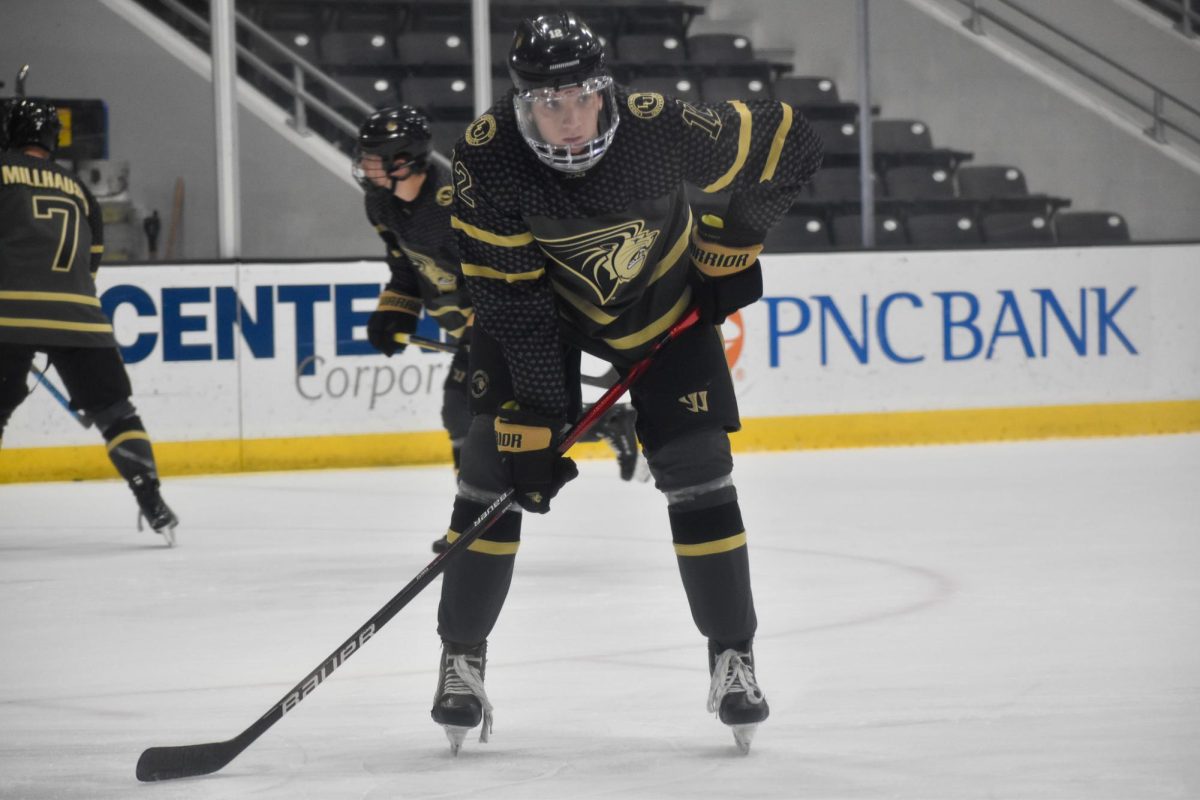 Gage Vierzba warms up during a game against Liberty University. 