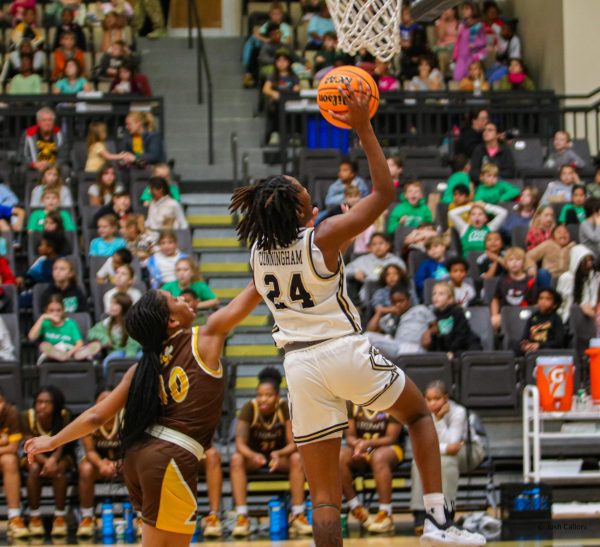 Mykayla Cunningham goes in for a layup during a game against Harris-Stowe University. 