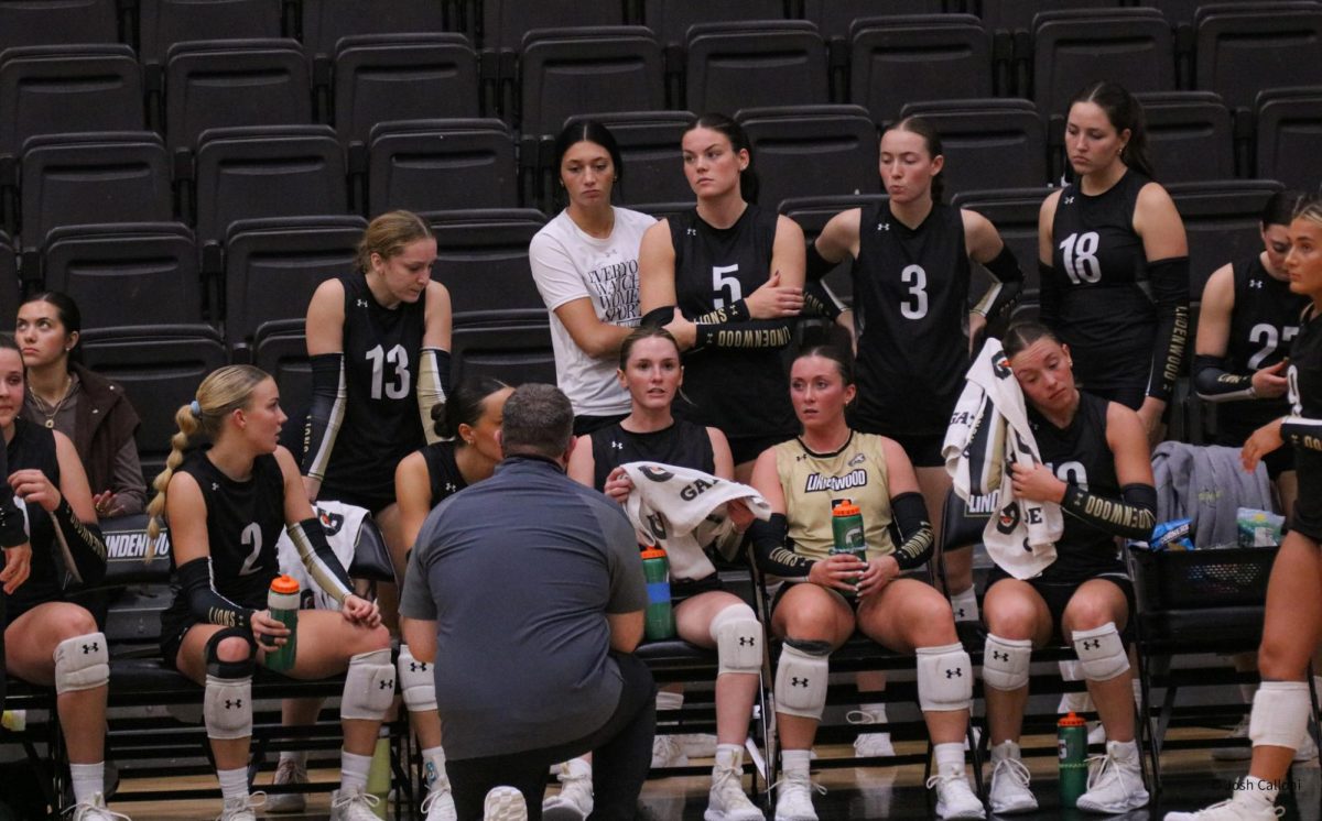 Coach Will Condon talks things over with the Lindenwood women's volleyball team during a game against Western Illinois. 