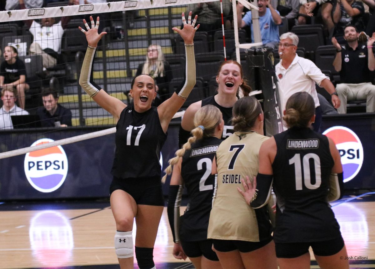 Ashley Geluck celebrates with her Lindenwood teammates after winning a set against Western Illinois. 