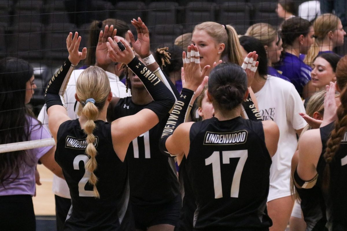 The Lindenwood women's volleyball team celebrates after defeating Western Illinois in four sets. 