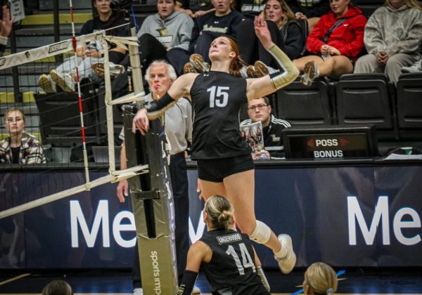 Autumn Bax leaps up to kill a ball during a game against SEMO. 